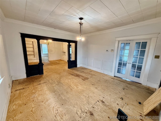 interior space with ornamental molding and french doors