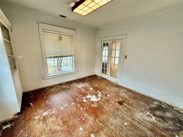 spare room featuring french doors