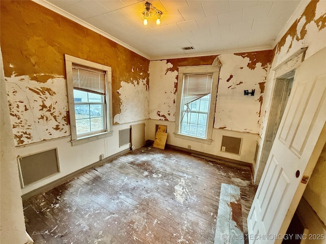 misc room with ornamental molding and plenty of natural light