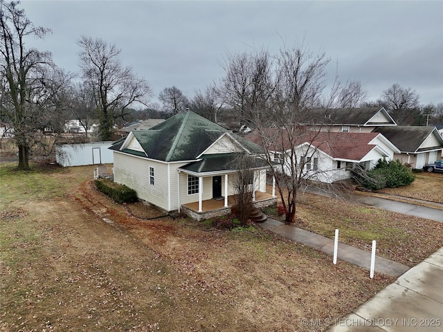 view of front facade with a water view and a porch