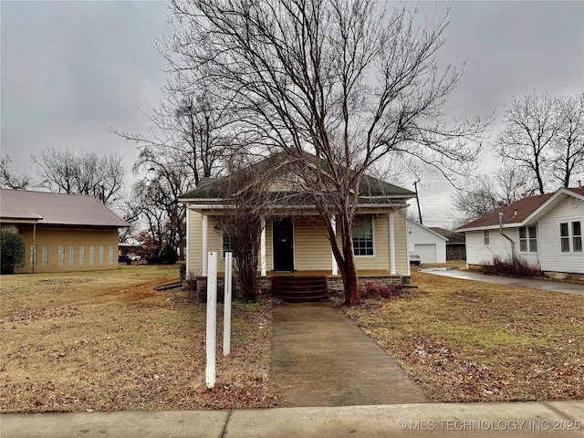 view of front of house featuring a garage and an outdoor structure