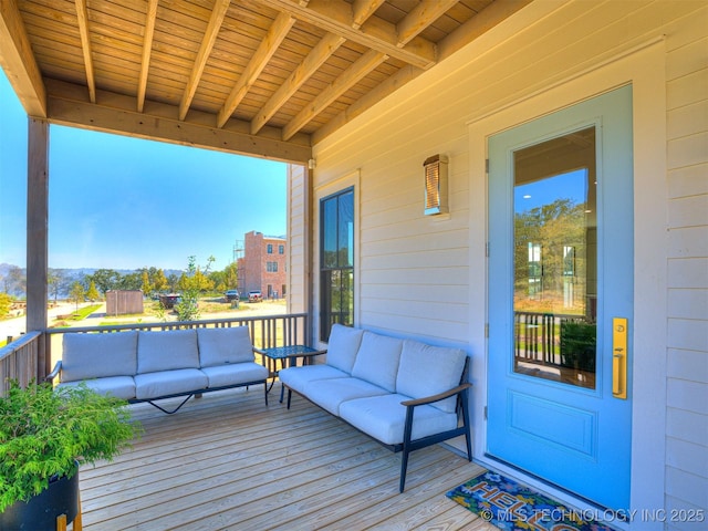 wooden deck featuring an outdoor hangout area