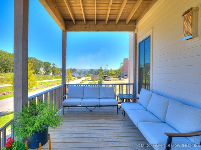 wooden terrace featuring outdoor lounge area