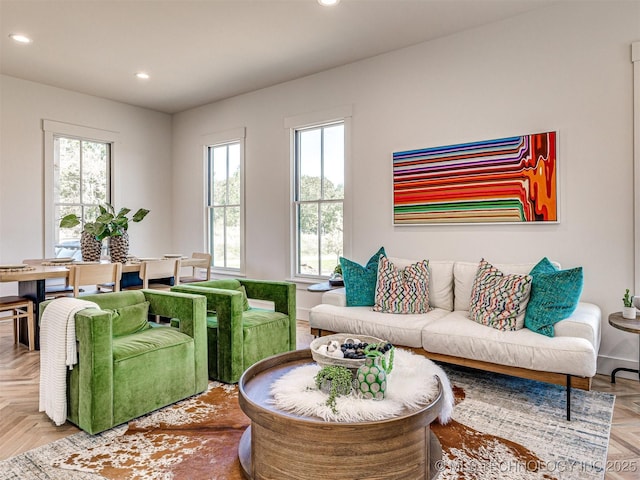 living room featuring parquet flooring and plenty of natural light