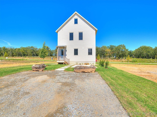 back of property with a yard