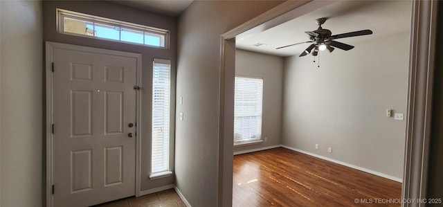 foyer with ceiling fan and hardwood / wood-style floors