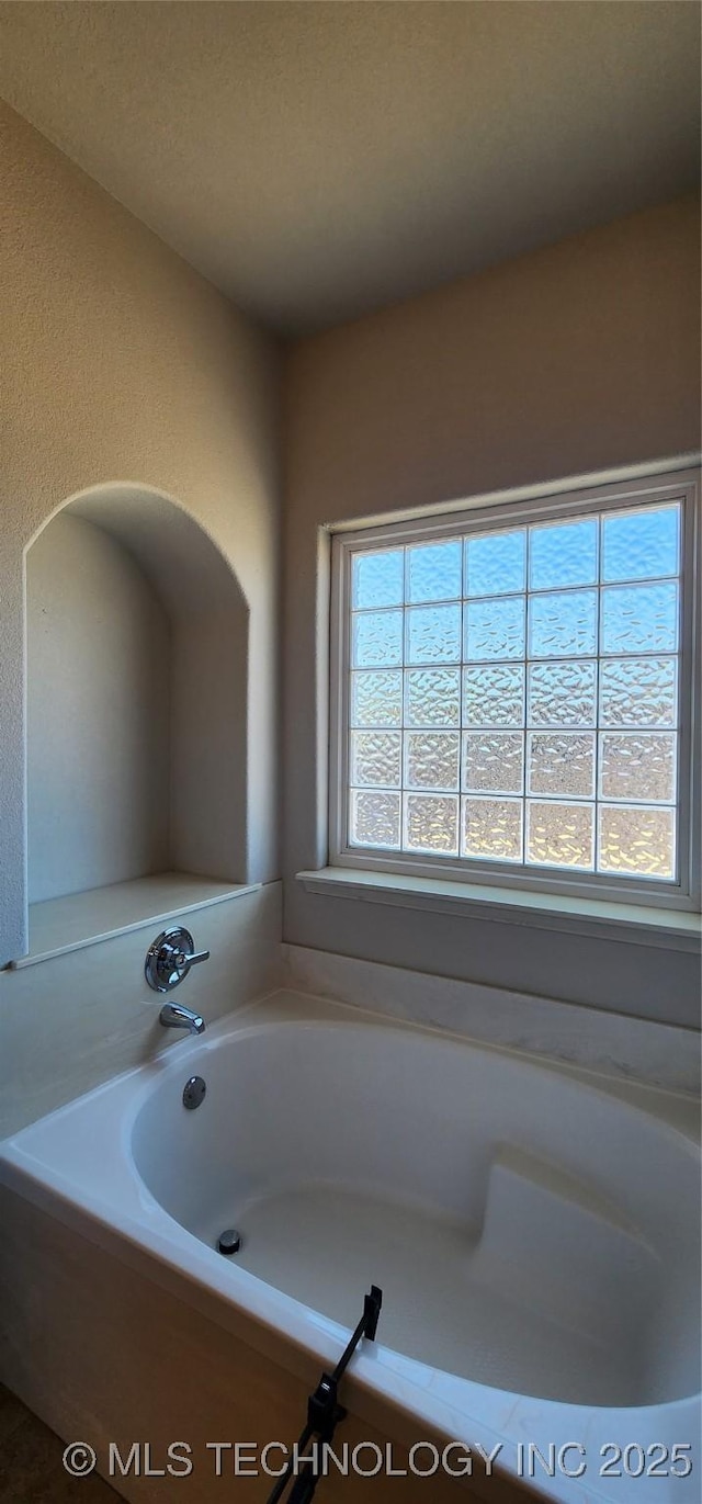 bathroom with a washtub