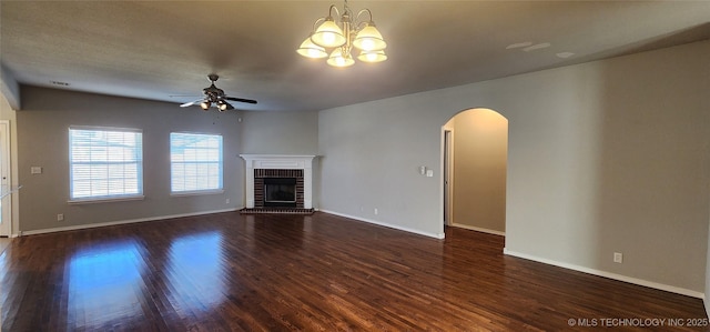 unfurnished living room featuring dark hardwood / wood-style flooring, ceiling fan, and a fireplace