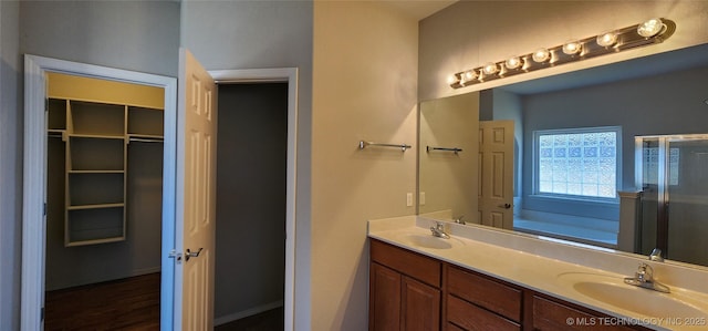 bathroom with vanity and shower with separate bathtub