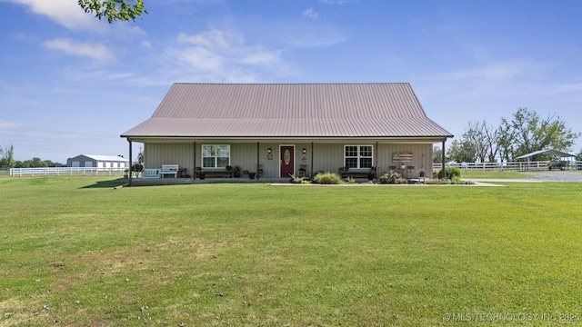 view of front of house with a front yard and a porch