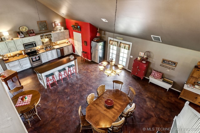 dining room with lofted ceiling