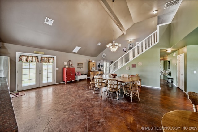 dining room with high vaulted ceiling, french doors, and a chandelier