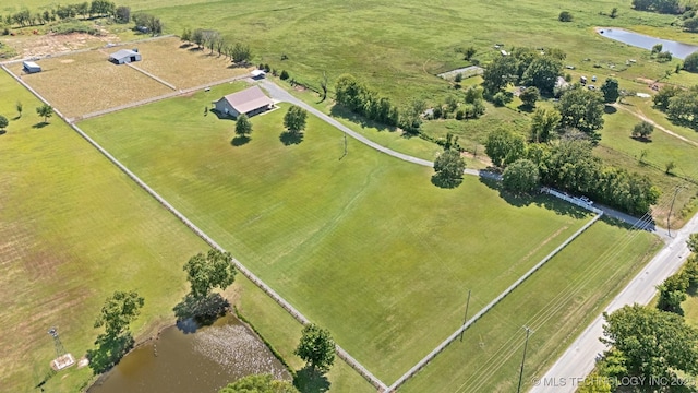 birds eye view of property featuring a rural view and a water view