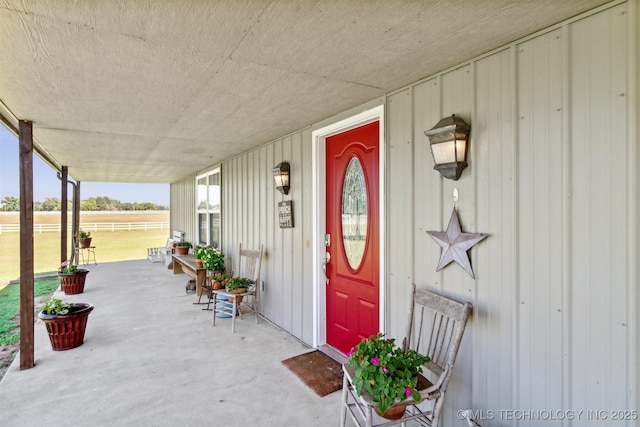 entrance to property featuring a porch