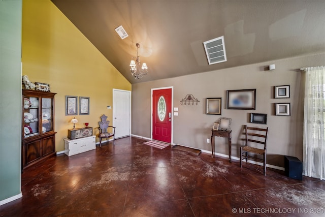 entryway featuring a notable chandelier and high vaulted ceiling