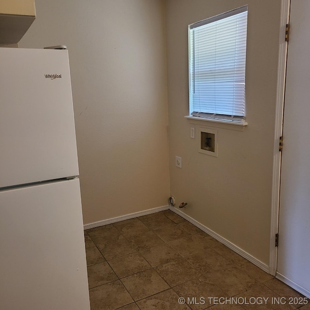 clothes washing area featuring washer hookup