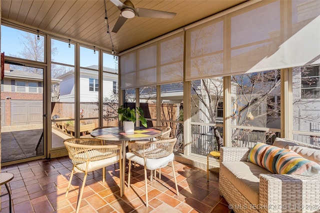 sunroom / solarium with wooden ceiling and ceiling fan