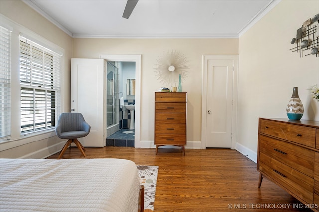 bedroom featuring ornamental molding, hardwood / wood-style floors, ceiling fan, and ensuite bathroom