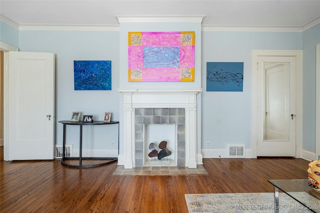 unfurnished living room featuring crown molding and dark hardwood / wood-style flooring