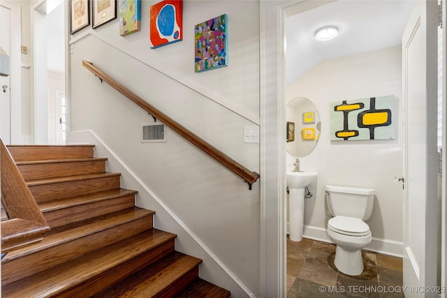 staircase featuring sink