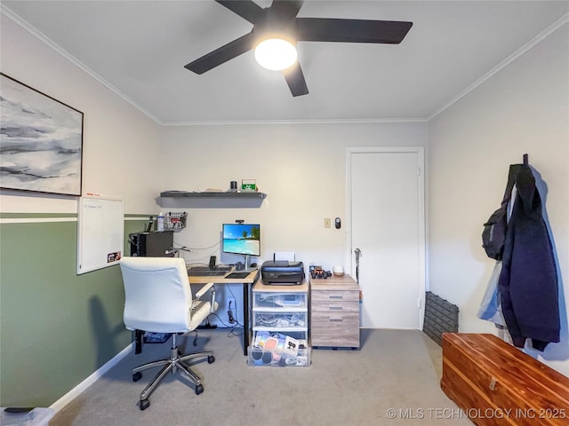 carpeted office featuring ceiling fan and ornamental molding