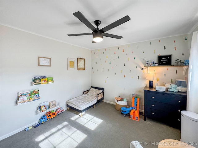 carpeted bedroom with ornamental molding and ceiling fan