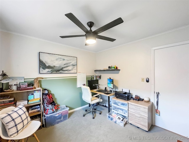 home office with ornamental molding, ceiling fan, and carpet flooring