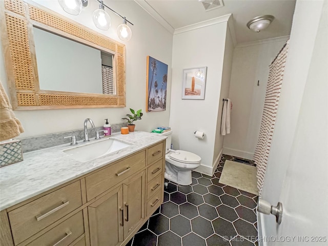 bathroom featuring ornamental molding, toilet, tile patterned flooring, and vanity