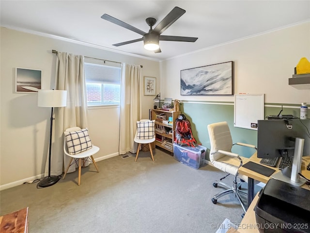 carpeted office featuring crown molding and ceiling fan