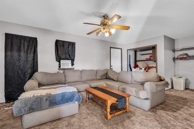 carpeted living room with cooling unit and ceiling fan