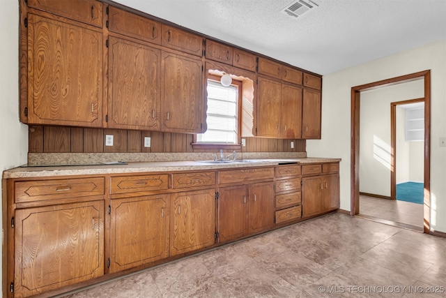 kitchen featuring a textured ceiling