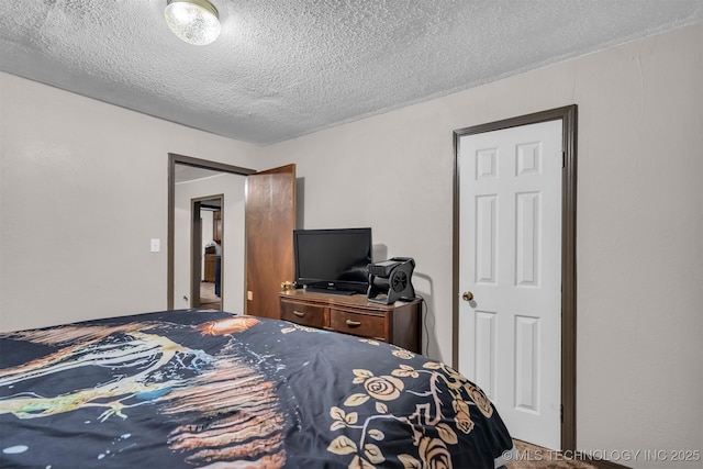 bedroom featuring a textured ceiling