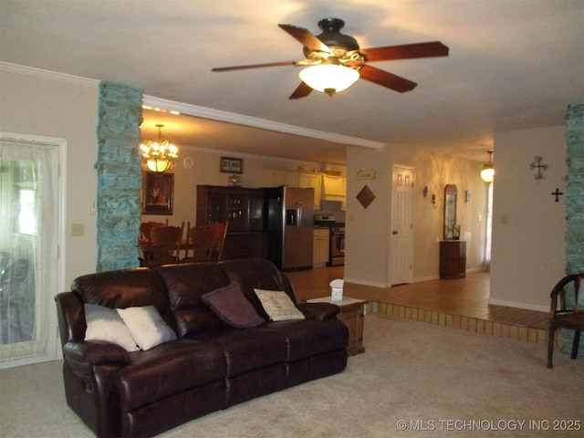 living room with crown molding, light colored carpet, and ceiling fan with notable chandelier