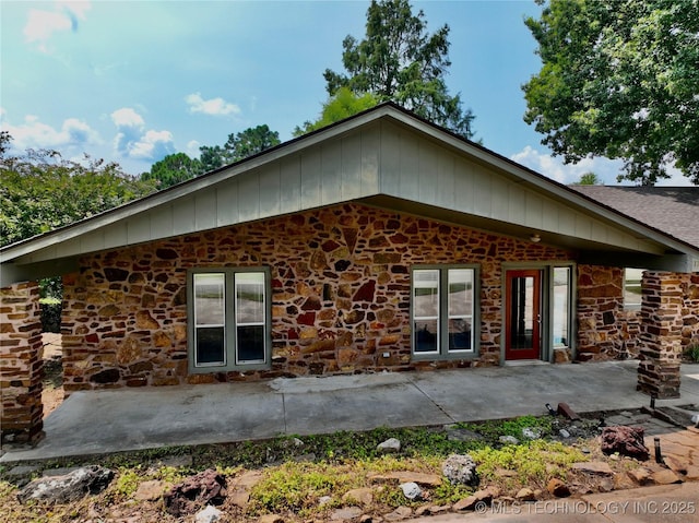 back of property with a patio area