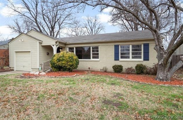 single story home with a garage and a front yard