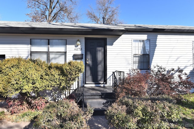 6273 E Marshall Pl, Tulsa, OK 74115 - view of exterior entry featuring roof with shingles