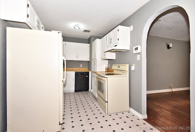 6273 E Marshall Pl, Tulsa, OK 74115 - kitchen with white appliances, arched walkways, a textured ceiling, and white cabinetry