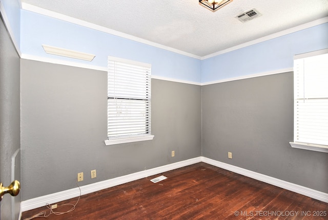 6273 E Marshall Pl, Tulsa, OK 74115 - empty room featuring baseboards, hardwood / wood-style floors, and visible vents