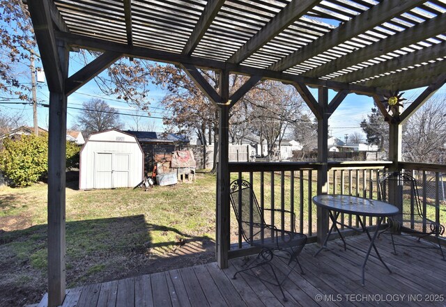 6273 E Marshall Pl, Tulsa, OK 74115 - wooden terrace with a storage shed, a lawn, a pergola, and an outbuilding