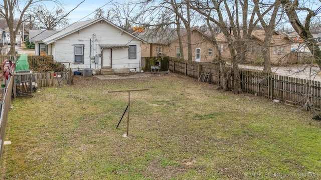 exterior space with cooling unit and a lawn