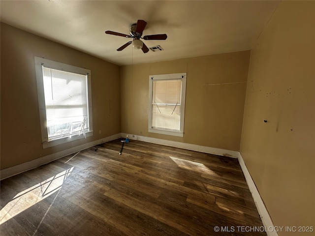 unfurnished room featuring ceiling fan and dark hardwood / wood-style flooring