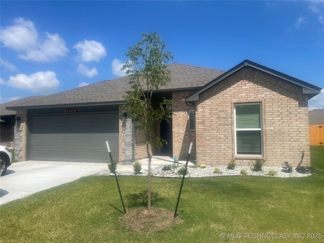 single story home with driveway, an attached garage, a shingled roof, a front lawn, and brick siding