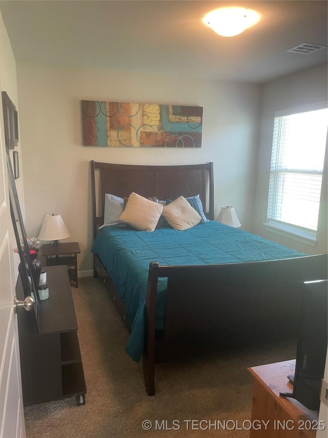 carpeted bedroom with visible vents