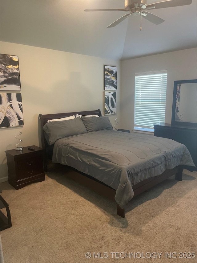 bedroom with lofted ceiling, carpet flooring, and ceiling fan