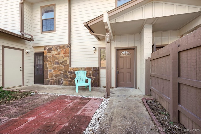 property entrance featuring a patio area