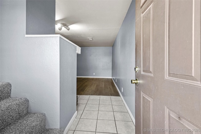 hallway with light tile patterned floors