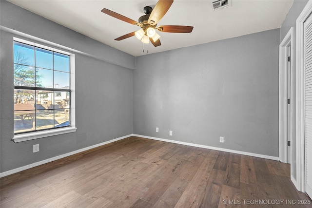 unfurnished room featuring hardwood / wood-style flooring and ceiling fan