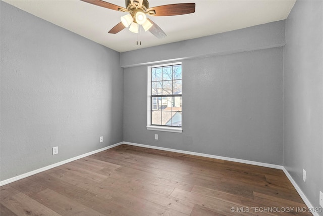 unfurnished room with ceiling fan and wood-type flooring