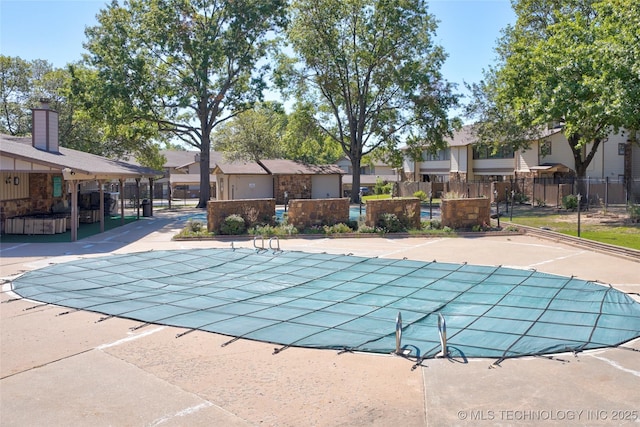 view of swimming pool with a patio