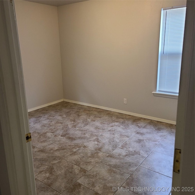 empty room with light tile patterned flooring